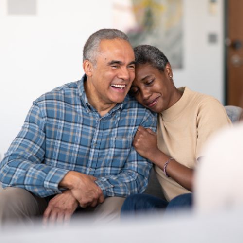 An older couple sharing a warm, comforting moment — the kind of compassionate care we provide at Bloor Hopewood Medical Clinic