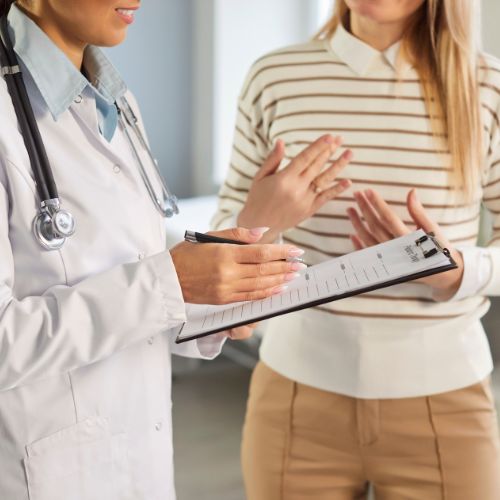 Family physician at Bloor Hopewood Medical Clinic listening attentively to a patient